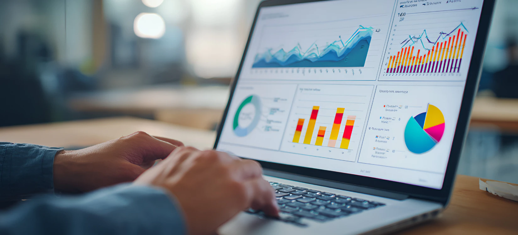 A dealership owner looks at data on a laptop screen that shows visibility rankings.